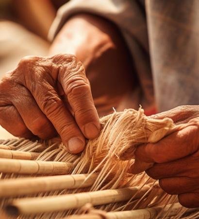 Elderly people's hands weaving white silk cloth On the Heritage Craft loom.AI Generative.